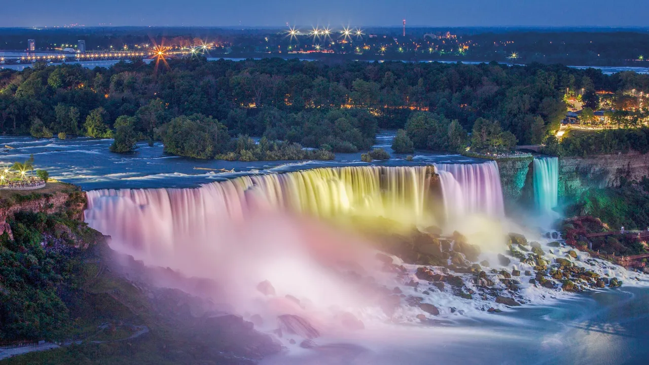 Horseshoe Falls illuminated at night in Niagara Falls, Ontario, Canada
